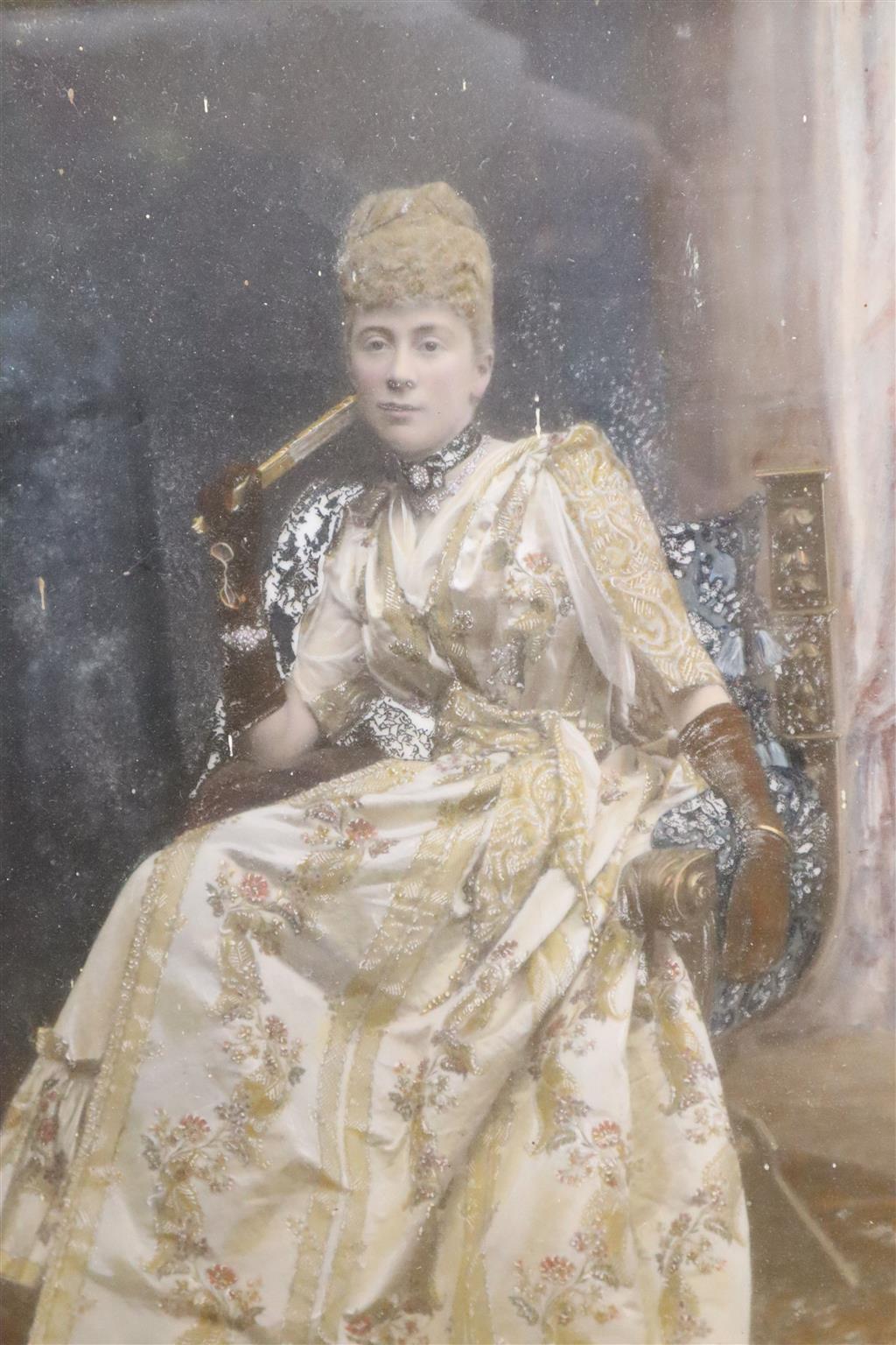An Edwardian hand tinted photographic portrait of a seated lady, in ornate frame, image 29 x 24cm
